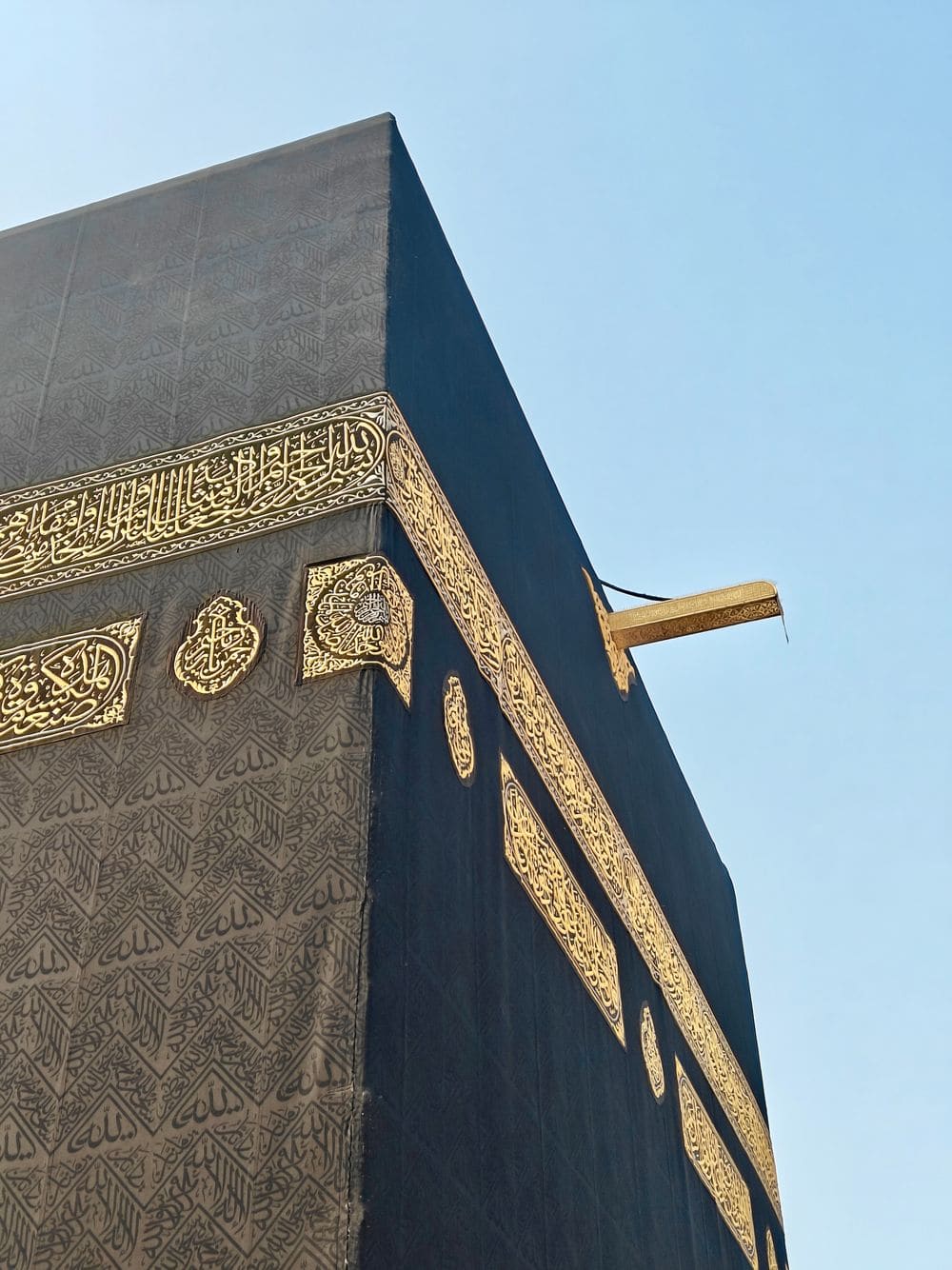 Close-up of the Kaaba's Kiswah with gold calligraphy