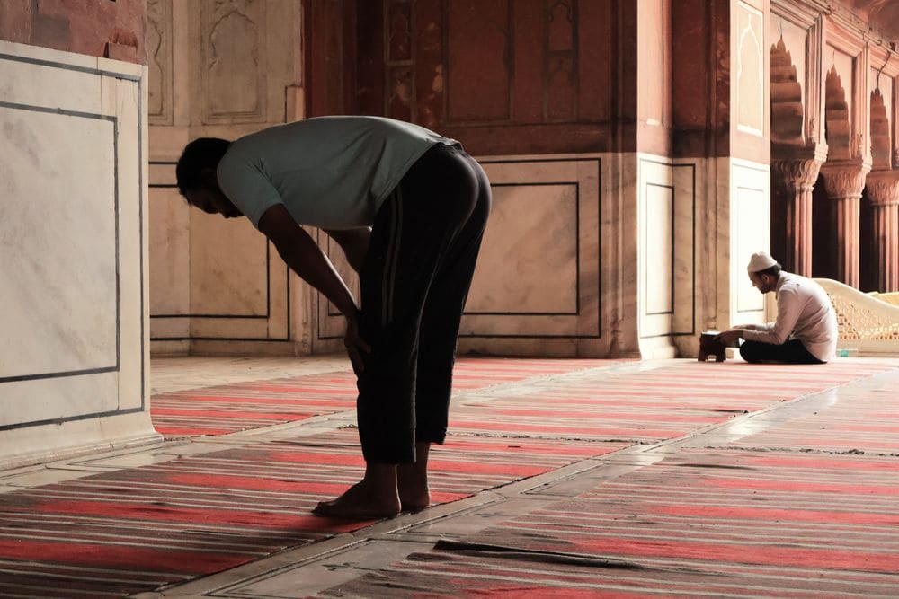 Worshipper praying inside a mosque