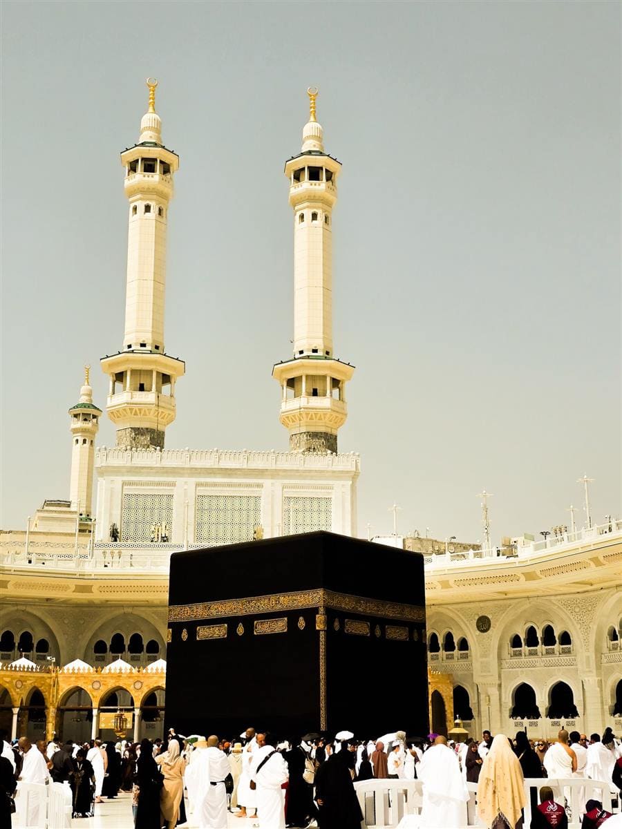 The Kaaba and minarets of Masjid al-Haram at golden hour